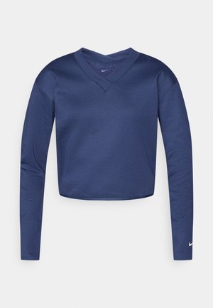 Μπλε ναυτικό crop top με μακριά μανίκια και σχεδιασμό V-neck. Διαθέτει λείο υλικό και μικρό λευκό λογότυπο στο αριστερό μανίκι.