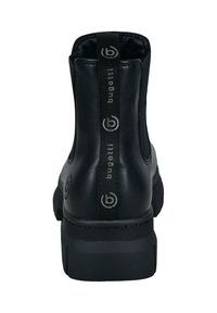 Schwarze Lederstiefelette mit abgerundeter Spitze, elastischen seitlichen Einsätzen und einem markierten Zugtab. Verfügt über eine strukturierte Gummisohle.