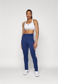 adidas Sportswear TIRO CUT 3 STRIPES TRACKPANTS - Treniņtērpa apakšdaļas - navy blue/white/better scarlet