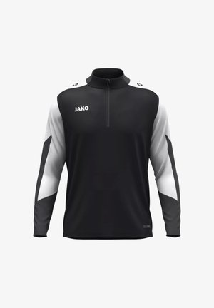 Schwarz-weißes Sportoberteil mit langen Ärmeln, hohem Kragen, Viertelreißverschluss und Logo auf der Vorderseite; mit kontrastierenden Mustern an den Ärmeln.