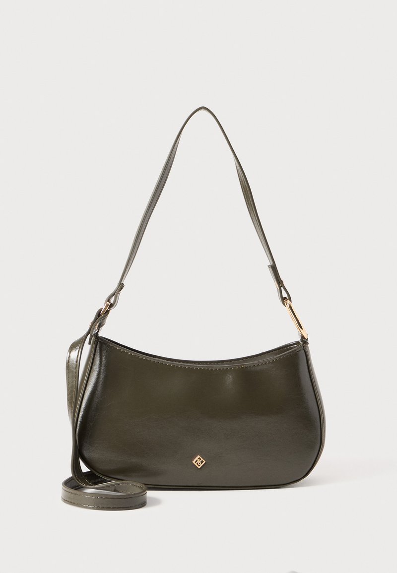Dark olive green handbag with a curved shape, smooth leather texture, adjustable strap, and a small gold-tone logo on the front.
