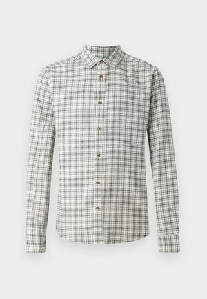 Chemise à manches longues en tartan blanc et marine, dotée d'un col boutonné et de boutons en bois, avec un motif à carreaux sur l'ensemble.