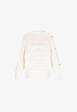 Witte gebreide trui met een losse pasvorm, geribde zoom en grote knopen langs één schouder. Geweven patroon door de stof.
