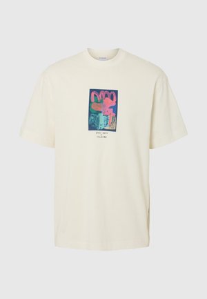 Krémové bavlněné tričko s barevným grafickým potiskem v růžové, zelené a modré barvě umístěným uprostřed přední strany, s krátkým rukávem a kulatým výstřihem.