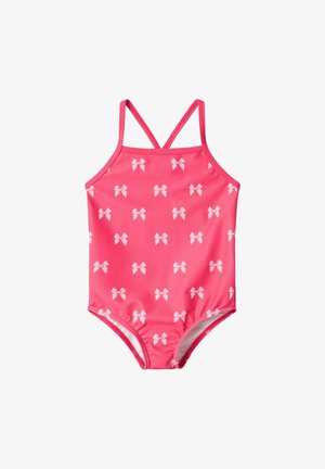 Pink swimsuit with white bow patterns, featuring a sleeveless design and crossed straps. Made from stretchy, smooth fabric.