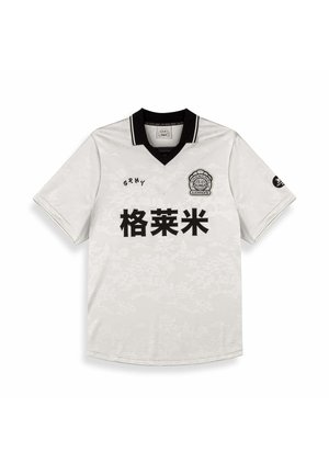 Korte mouwen witte jersey met een zwarte kraag. Bevat een subtiele bloemenstructuur en zwarte gedrukte tekst. Logo op de borst en mouw.