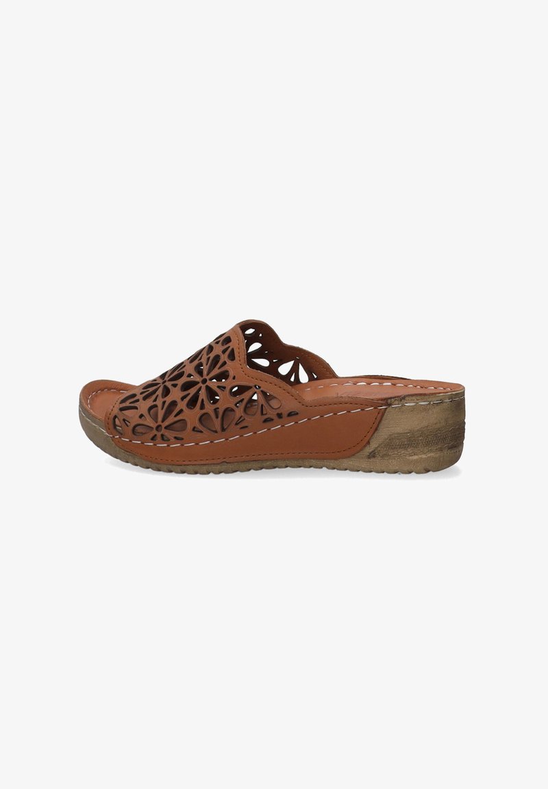 Brown open-toe slide sandal with floral cutout design, textured light brown sole, and contrasting white stitching along the edge.