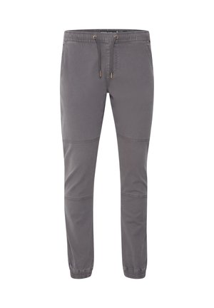 Pantalon de jogging gris en tissu doux, doté d'une taille élastique, d'un cordon de serrage et de chevilles ajustées avec des accents de panneaux cousus.