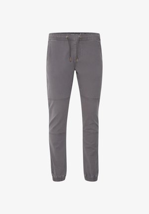 Pelēku sporta bikses, kas izgatavotas no mīksta auduma, ar elastīgu jostasvietu, nešaļojamu auklu un apakšdaļu ar šuvju paneļu akcentiem.