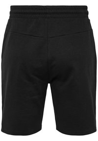 Shorts noirs jusqu'aux genoux avec une taille élastique, des coutures visibles et une texture de tissu lisse.