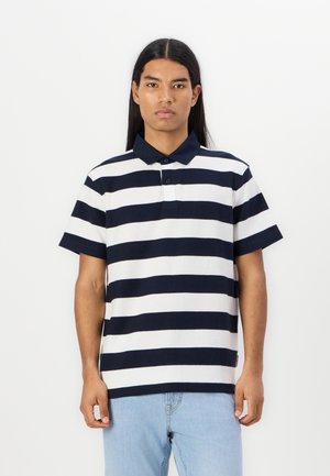 Navy and white striped polo shirt with a ribbed collar, short sleeves, and a textured fabric; features a three-button placket.