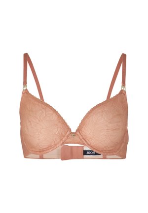 Soutien-gorge en dentelle de couleur pêche douce avec des bonnets rembourrés, des bretelles réglables et un motif floral. Il présente un détail en métal doré au centre.