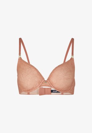 Soutien-gorge en dentelle de couleur pêche douce avec des bonnets rembourrés, des bretelles réglables et un motif floral. Il présente un détail en métal doré au centre.