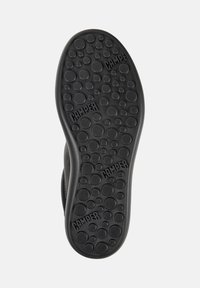 Black shoe sole features a textured surface with circular patterns and "CAMPER" branding, showcasing size 38.