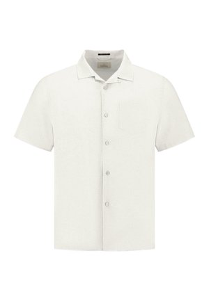 Chemise à manches courtes en beige clair, présentant une texture subtile, un col pointu et une poche poitrine unique.