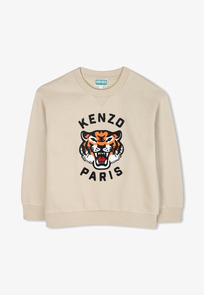 Sweatshirt beige avec col rond, présentant un grand motif de tigre noir et orange ainsi que le texte "KENZO PARIS", fabriqué en tissu doux avec des poignets côtelés.