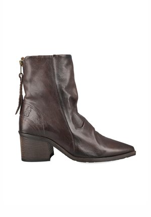 Dark brown leather ankle boot with a low block heel, pointed toe, and side zipper with a leather pull tab.