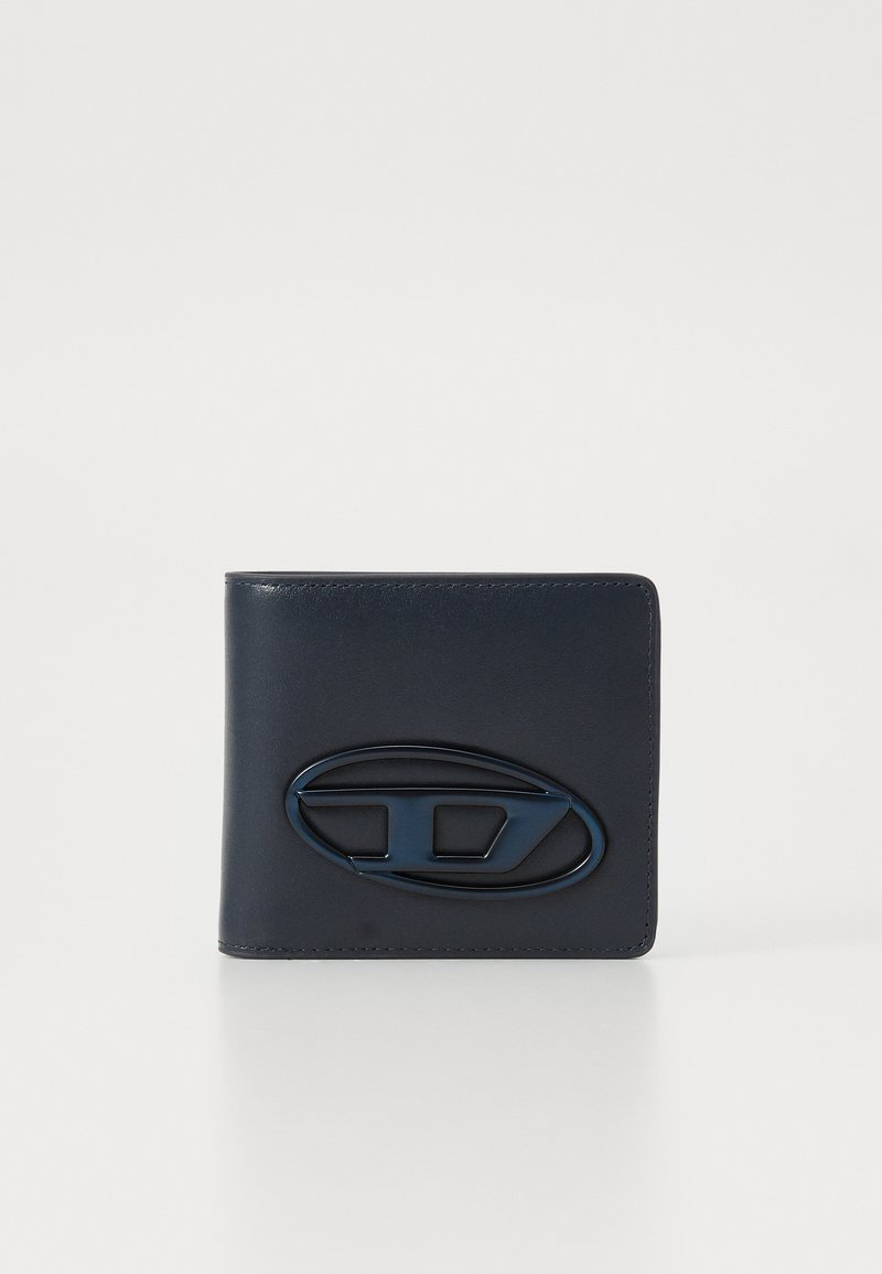 Navy leather wallet with a smooth texture, featuring a prominent glossy oval logo accent in dark blue. Folded bi-fold design.