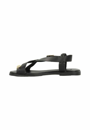 Black sandal with crisscross strap design, flat sole, smooth texture, adjustable back strap, and gold accents on front.