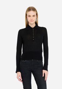 Polo a maniche lunghe nero con colletto, dotato di una pattina con bottoni e una vita aderente, realizzato in un materiale knit leggero.