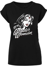 Black short-sleeve t-shirt featuring a graphic of a woman with wavy hair, red lips, and a headband, with "Wonder Woman" text in white and red.