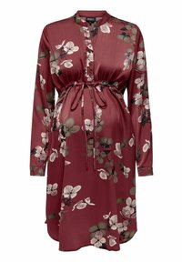 Těhotenské šaty z burgundské saténové tkaniny s dlouhými rukávy, květinovým vzorem, zapínáním na knoflíky a nastavitelním páskem v pase pro padnoucí siluetu.