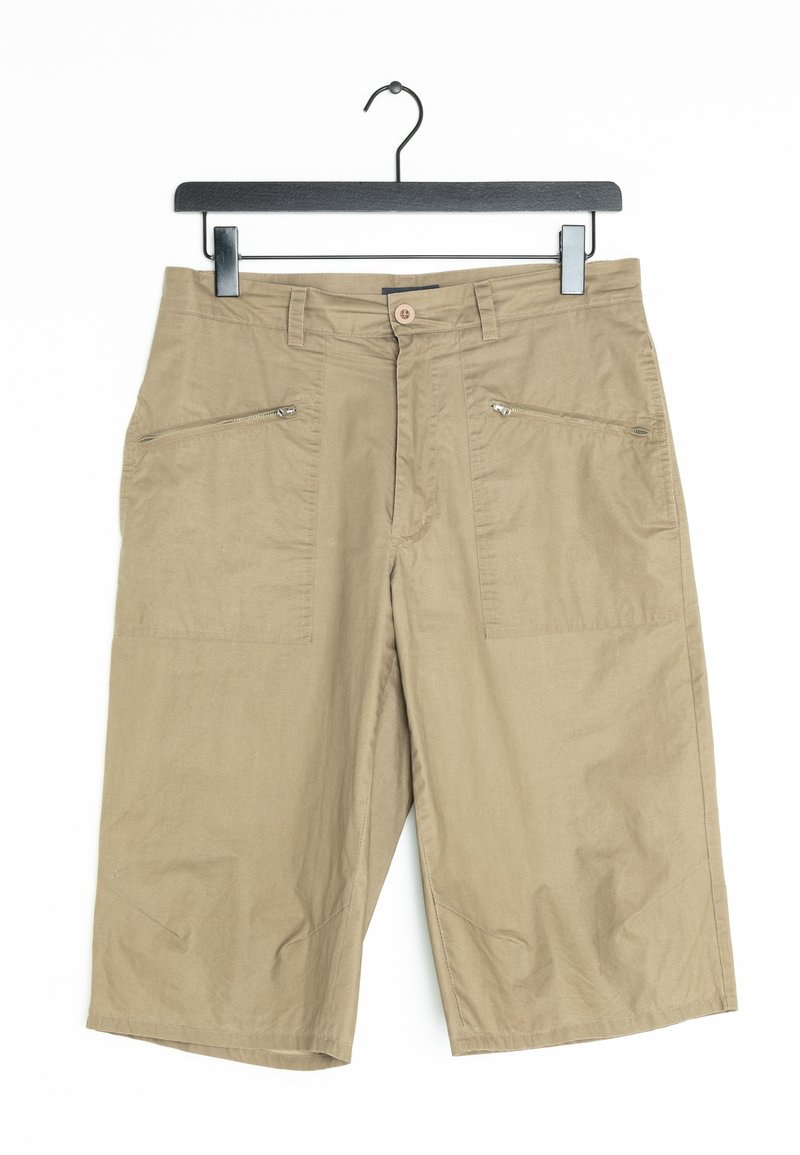 Beige knee-length shorts with two zippered front pockets, a button closure, and smooth fabric texture. Hangs from a black plastic hanger.