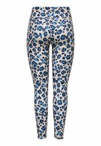 Leggings blancs avec imprimé léopard bleu et noir, taille haute, longueur intégrale, montrés de dos sur fond blanc.