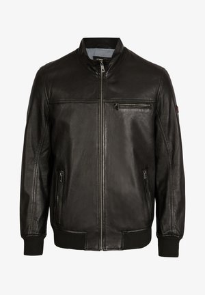 Čierna kožená bunda s vysokým golierom, predným zipsom a rebrovanými manžetami. Obsahuje dve bočné vrecká a jedno vrecko na hrudi so zipsom.