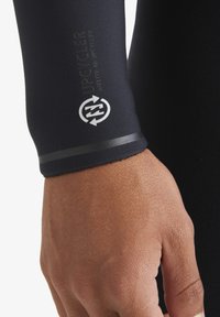 Black neoprene sleeve with gray logo and text. Features a smooth texture and a fitted design, showcasing durability and flexibility.