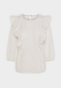 Blusa bianca con maniche a volant, intricate ricami ad occhio, schiena a chiave e maniche lunghe a palloncino. Materiale in cotone morbido.