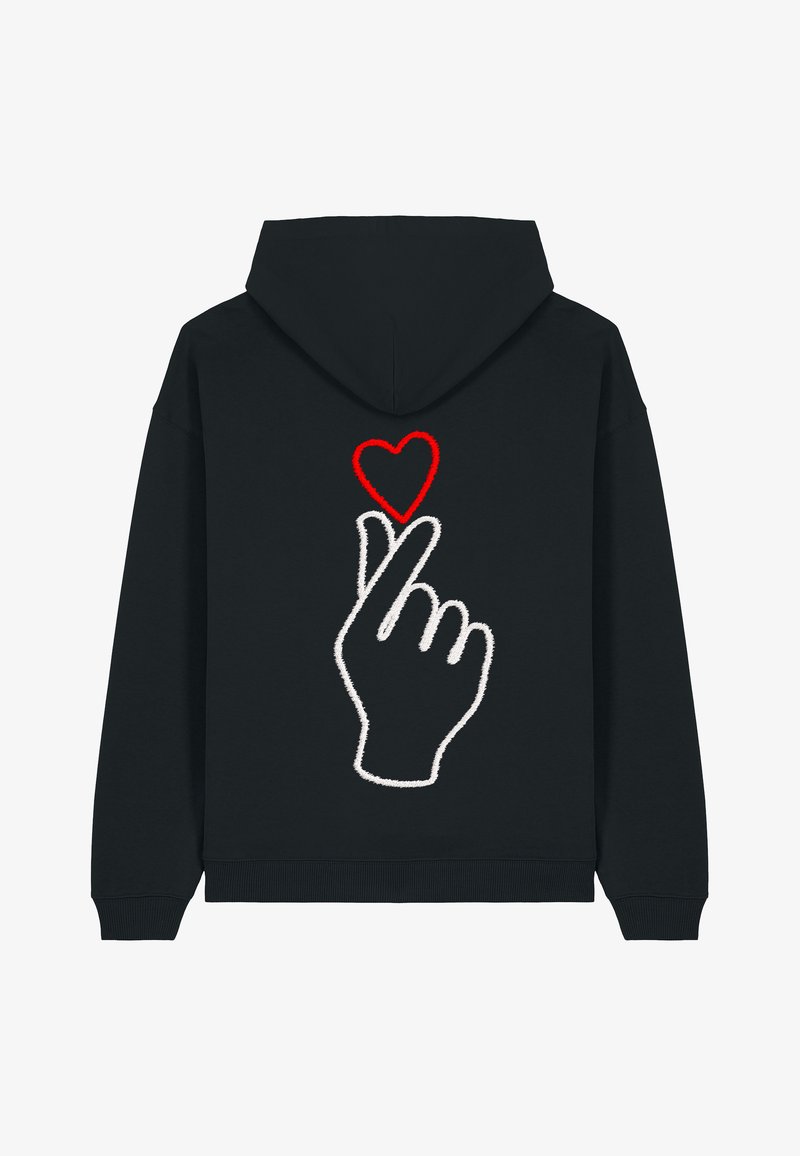 Hoodie noir avec un geste de la main brodé en blanc et un cœur rouge au-dessus, situé au dos. Tissu doux avec une coupe décontractée.