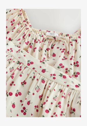 Rochie florală dintr-un material ușor. Fundal crem cu căpșuni mici roșii și frunze verzi. Are gât adunat și talie cu falduri.