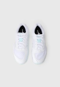 White athletic shoes with mesh panels, lace-up design, and turquoise accents. Features a textured sole and black inner lining.