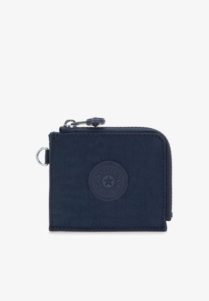 Petit portefeuille bleu marine avec fermeture éclair, écusson logo rond et anneau en métal sur le côté, fabriqué en tissu texturé.