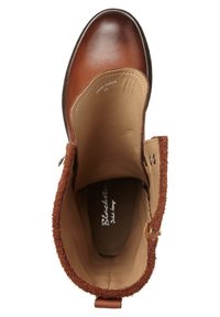 Bottine en cuir marron avec bordure en fourrure, fermeture éclair ouverte et étiquette intérieure visible portant la mention "Blacktree Delft design" taille 37.