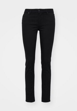 Jean skinny noir en denim avec une texture lisse, design à cinq poches, passants de ceinture, fermeture à bouton, et sans motifs ni ornements visibles.