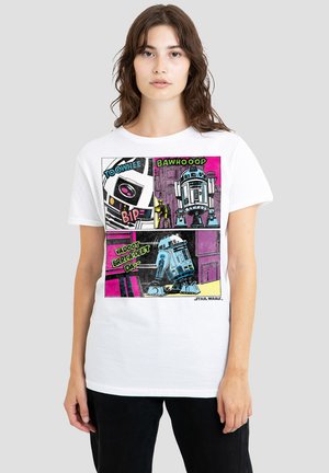 White cotton t-shirt featuring a graphic print of robot characters in comic-style panels with bright colors and bold text elements.