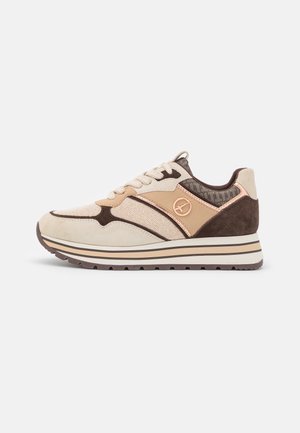 Beige and brown lace-up sneaker with mixed fabric panels, striped thick sole, and round logo detail on the side.