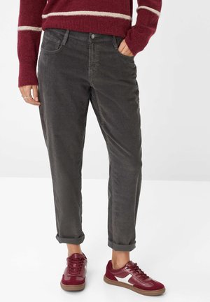 Gray corduroy pants with a straight leg, featuring a front pocket, rolled cuffs, and a smooth texture, paired with burgundy athletic shoes.