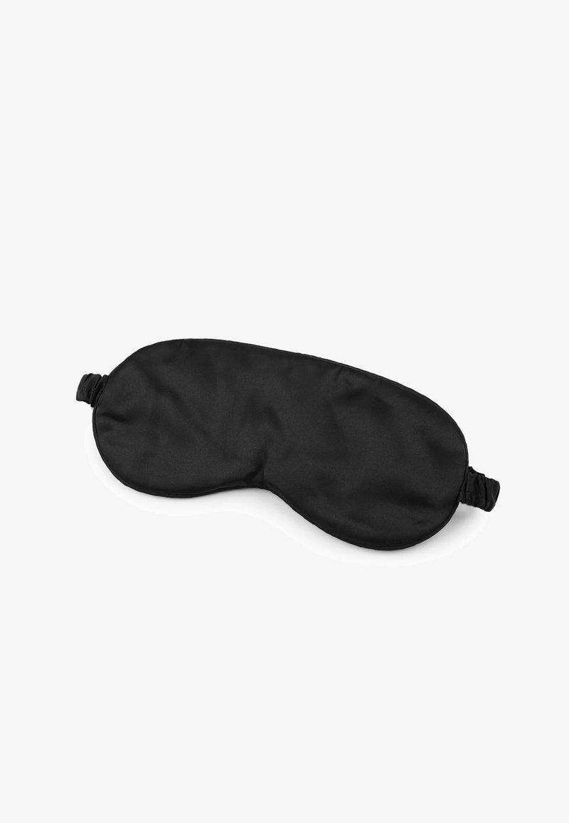 Mascherina nera per il sonno realizzata in tessuto liscio, forma contornata per il comfort, con una fascia elastica per una vestibilità sicura. Senza motivi o dettagli in metallo.