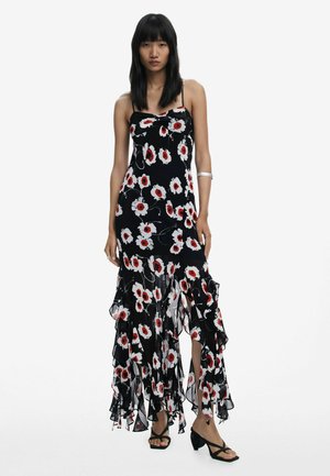Black floral dress with white and red flowers, ruffled hem, spaghetti straps, slim fit, and a lightweight fabric texture.