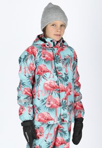 Flamingo-patterned jacket in light blue with pink accents, made from waterproof material. Features a hood and black gloves.