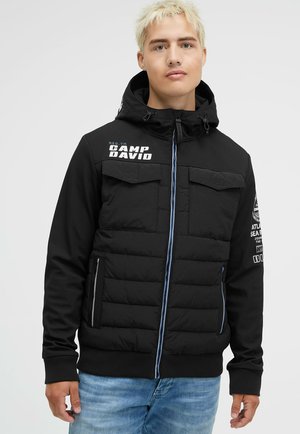 MIT RÜCKEN-PRINT - Winter jacket - black