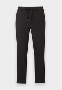 Mustad sirgelõikelised püksid, millel on elastne vöökoht ja lipsuotsad metallist, laotatud lamedalt heledale taustale.