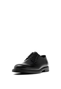 Black leather oxford shoe with a smooth finish, round toe, and five-eyelet lace-up design. Vibrant texture and low-profile rubber sole.