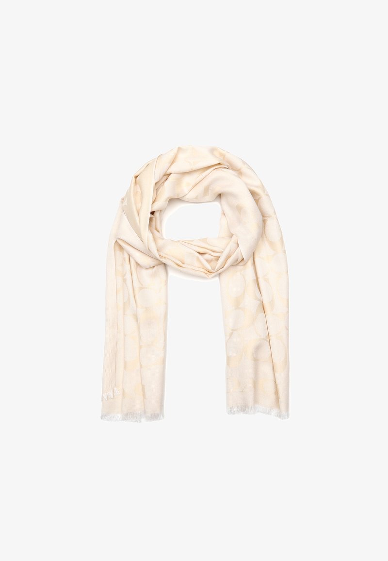 Écharpe beige clair avec un motif circulaire subtil, fabriquée en tissu doux, finie par des bords frangés pour ajouter de la texture et des détails.