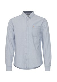 Striped long-sleeve shirt in light blue and white, button-up front, single chest pocket, and a rounded hem. Material appears lightweight and breathable.