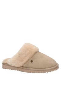 Beige suède slof met een pluizige, tan kleurige bontvoering, ronde neus en een geribbelde rubberen zool. Beschikt over een decoratieve goudkleurige knoopdetails.