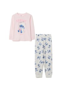 Top de manga larga rosa con el texto "SUNDAY es día de relajación" y un personaje de dibujos animados azul. Pantalones blancos con el personaje azul y acentos rosas.